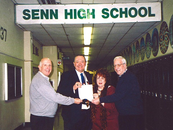 Reunion class hands check to Senn principal